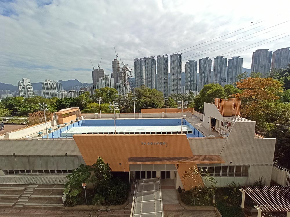 existing swimming pool. View from an opposite teaching block 